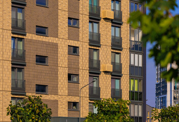 City view on a sunny day. Modern buildings, walls and windows. 