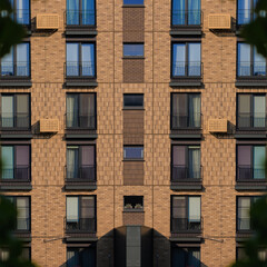 City view on a sunny day. Modern buildings, walls and windows. 