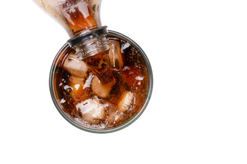 glass of cola with ice cubes on white background. Top view