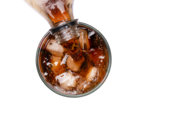 glass of cola with ice cubes on white background. Top view