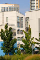 Cityscape on a summer day, modern buildings and houses 
