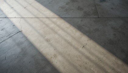 Sunlight streaming through cracks on concrete floor indoor space photography industrial environment close-up shot light and shadow play