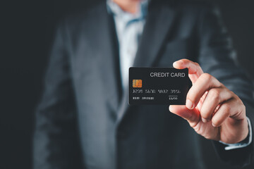 businessman hold credit card and use smartphone to buy or purchase produce payment online. The concept of finance and online shopping.