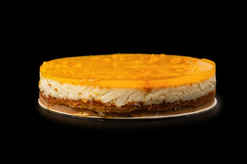 Orange cheesecake isolated on a white background.