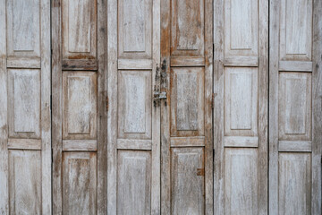 Weathered wooden doors rustic setting photography architectural detail close-up textured surfaces