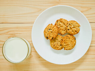 Oatmeal cookies with raisin and a glass of milk
