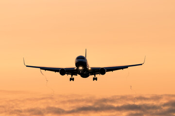 plane landing at sunrise
