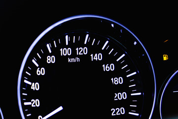 Car miles or Speedometer of on dashboard.