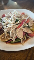 Spicy papaya salad is a spicy dish in Thailand.