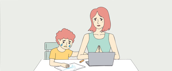young boy cries while drawing as his mother comforts him looking at a laptop