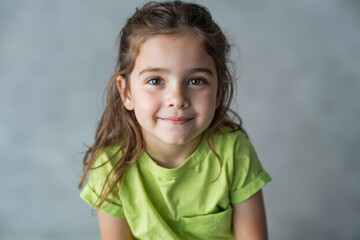 Portrait of smiling young girl in green shirt with soft light and abstract background in studio setting. Ai generative.