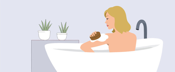 blonde woman using a bath puff in a white bathtub