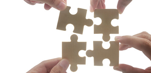 Collaborative puzzle assembly studio photography bright close-up teamwork concept