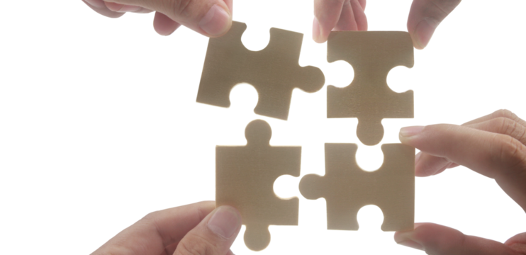 Collaborative puzzle assembly studio photography bright close-up teamwork concept