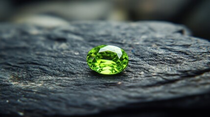 Oval-shaped zircon gem in vibrant green, displayed against smooth black stone.