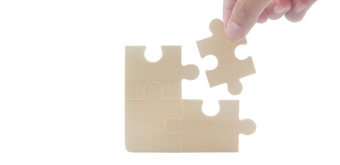 Puzzle assembly action home setting instructional content minimalist environment close-up view problem-solving concept