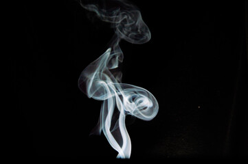 Artistic smoke trail isolated on black