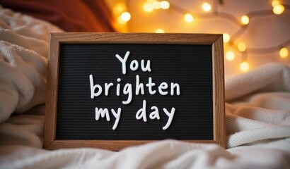 Inspirational quote "You brighten my day" on a cozy romantic background