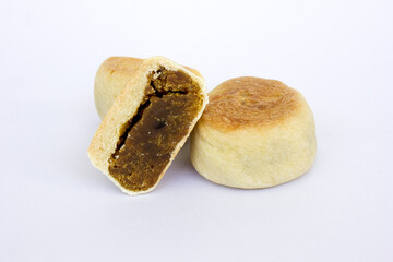 Bakpia pathok , Indonesian Traditional Cake with Chinese Influence. It made from a mixture of green beans, cheese and sugar, which is wrapped in flour, then baked.
