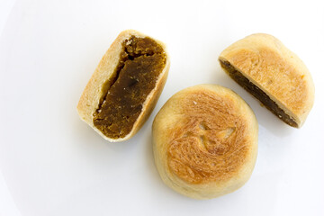 Bakpia pathok , Indonesian Traditional Cake with Chinese Influence. It made from a mixture of green beans, cheese and sugar, which is wrapped in flour, then baked.