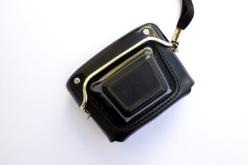 Black leather case for analog camera on white background.