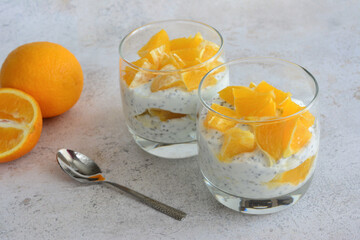 Chia Seed Pudding with chopped orange fruit in drinking glass