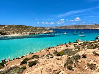 Republic of Malta, Comino Island, the sea where you can see boats floating, crystal clear water,...
