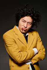 Creative expression in spring fashion featuring a stylish Asian man in a studio