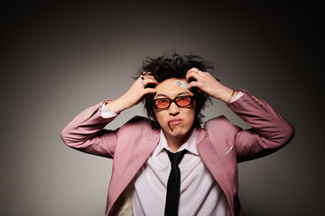 Stylish spring fashion in studio with an Asian man showcasing unique flair