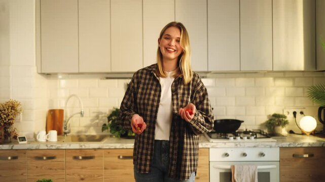 Beautiful blonde woman, girl smile, juggling tomatoes, cooking, cutting vegetables, greens, products, healthy lifestyle, recipe, kitchen, diet, nutrition, easy, positive, funny, cute, sunny, optimist