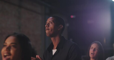 Man clapping in evangelical church worship, Afro-descendant male with joyful expression, black shirt, community celebration of faith, spiritual devotion and praise