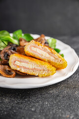 Cordon Bleu Cutlet meat chicken, ham, cheese appetizer dish fresh gourmet food background on the table rustic food top view copy space