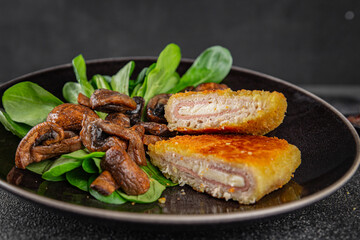 Cordon Bleu Cutlet meat chicken, ham, cheese appetizer dish fresh gourmet food background on the table rustic food top view copy space