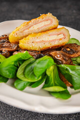 Cordon Bleu Cutlet meat chicken, ham, cheese appetizer dish fresh gourmet food background on the table rustic food top view copy space