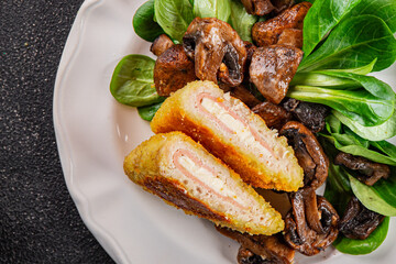 Cordon Bleu Cutlet meat chicken, ham, cheese appetizer dish fresh gourmet food background on the table rustic food top view copy space