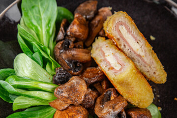 Cordon Bleu Cutlet meat chicken, ham, cheese appetizer dish fresh gourmet food background on the table rustic food top view copy space