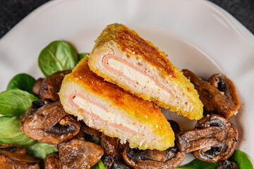 Cordon Bleu Cutlet meat chicken, ham, cheese appetizer dish fresh gourmet food background on the table rustic food top view copy space