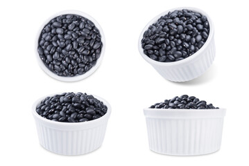 Black beans in a bowl on a white isolated background