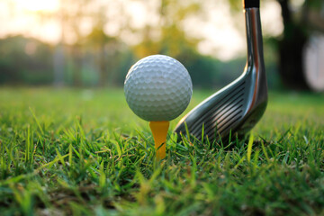 Close-Up of Golf Ball on Tee with Golf Club in Background