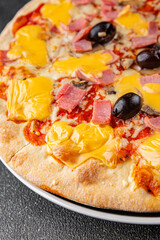 Pizza ham, mushrooms, olives, cheese appetizer vegetable dish fresh gourmet food background on the table rustic food top view copy space