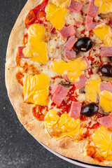 Pizza ham, mushrooms, olives, cheese appetizer vegetable dish fresh gourmet food background on the table rustic food top view copy space