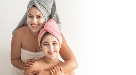Mother and daughter happily share a beauty treatment