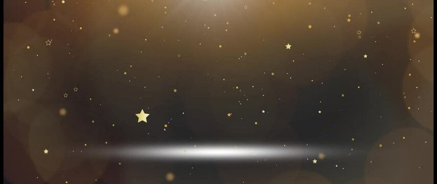 V&iacute;deo de um palco com luz central, amarela e reflexo branco no ch&atilde;o, explos&atilde;o de estrelas e confetes pela cena. 