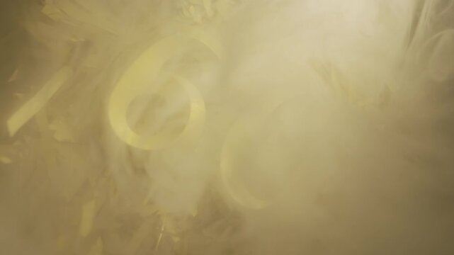 Golden candles number 60 on foiled festive background, anniversary numbers in smoke on golden background, sixtieth birthday.