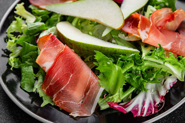 Salad pear ham vegetable dish fresh tasty gourmet food background on the table rustic food top view copy space