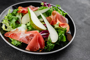 Salad pear ham vegetable dish fresh tasty gourmet food background on the table rustic food top view copy space