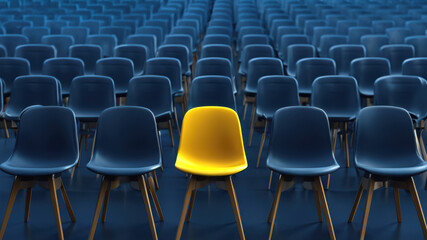 Dare to Be Different: The Bold Statement in Uniformity, One Yellow Chair in rows of blue chairs