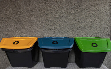 containers for sorting garbage on a gray background.garbage recycling