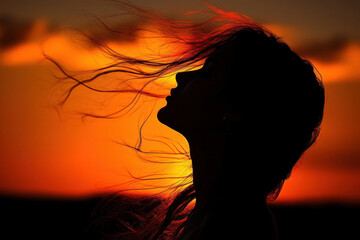 Woman with hair blowing in the wind, dancing freely in a sunlit meadow surrounded by vibrant wildflowers.