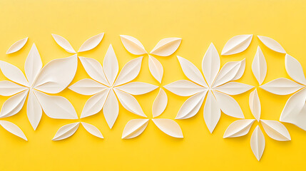 Obraz premium White paper flowers on yellow background.